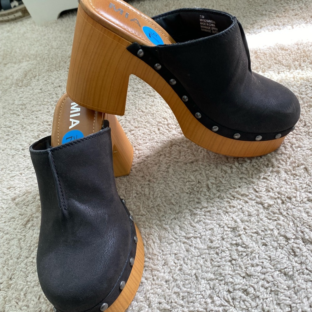 Black studded clogs